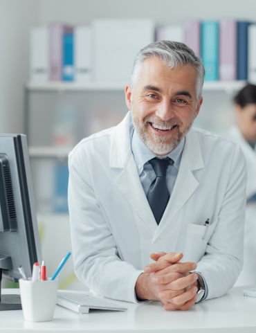 Mature male doctor smiling